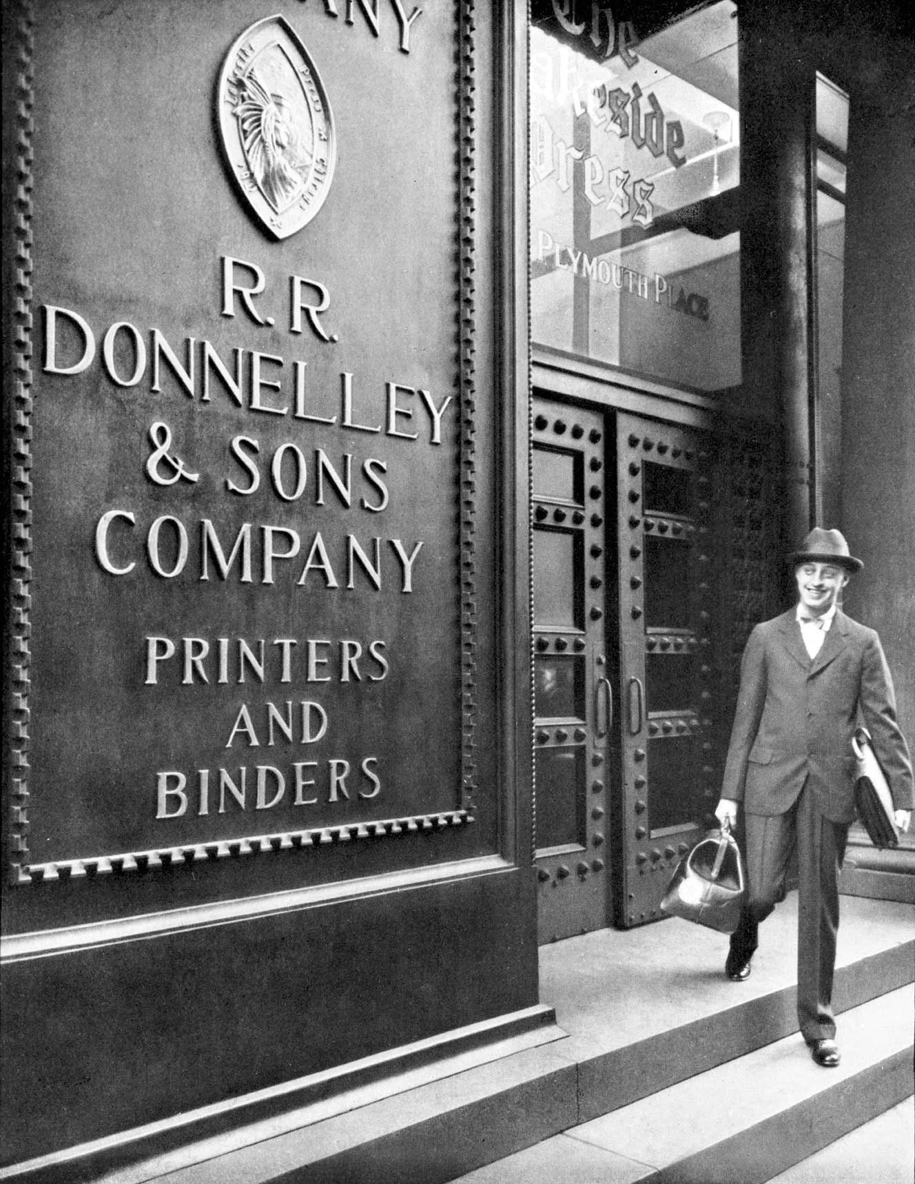 In front of the same building from the same time period