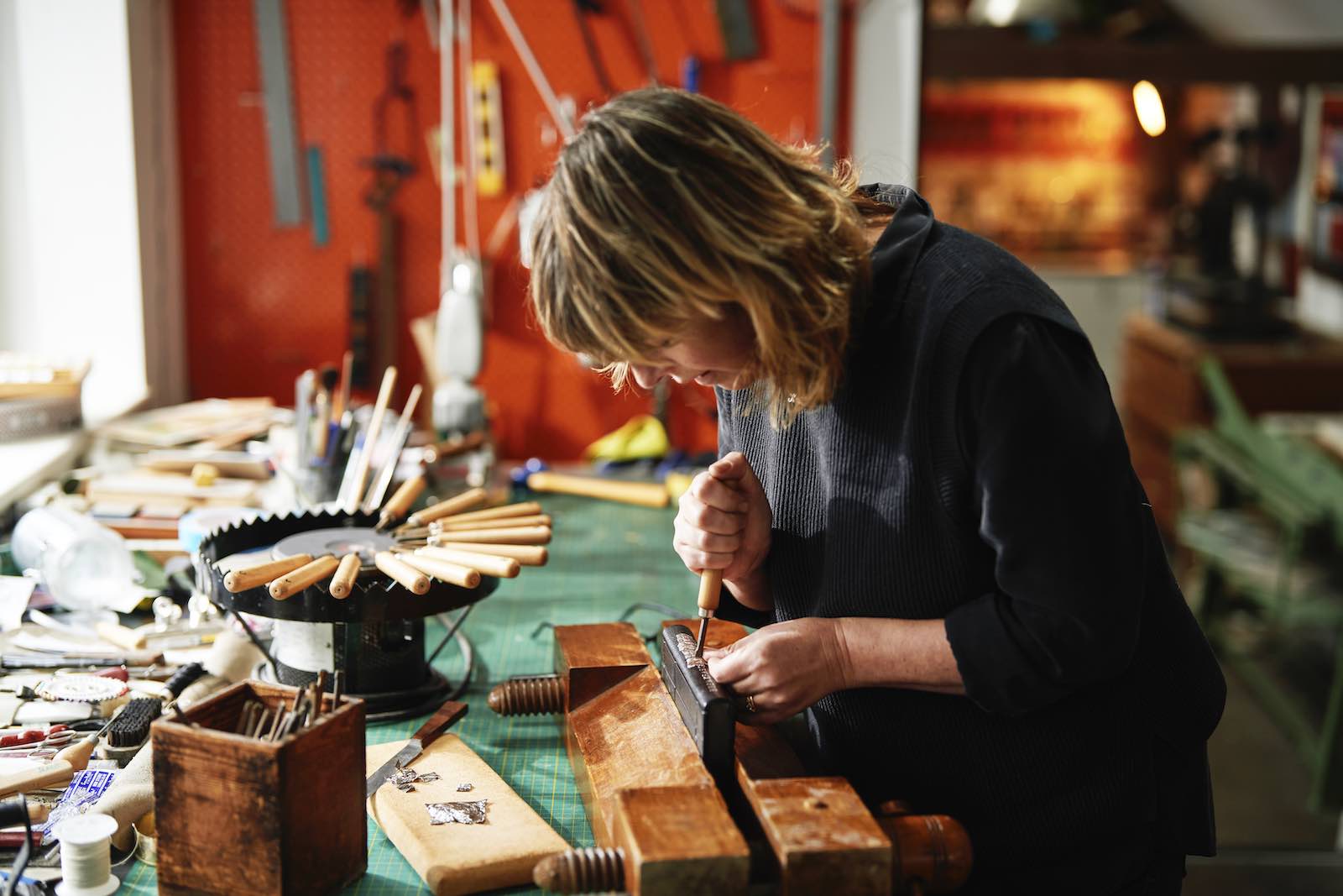 Kate Holland at work on the binding