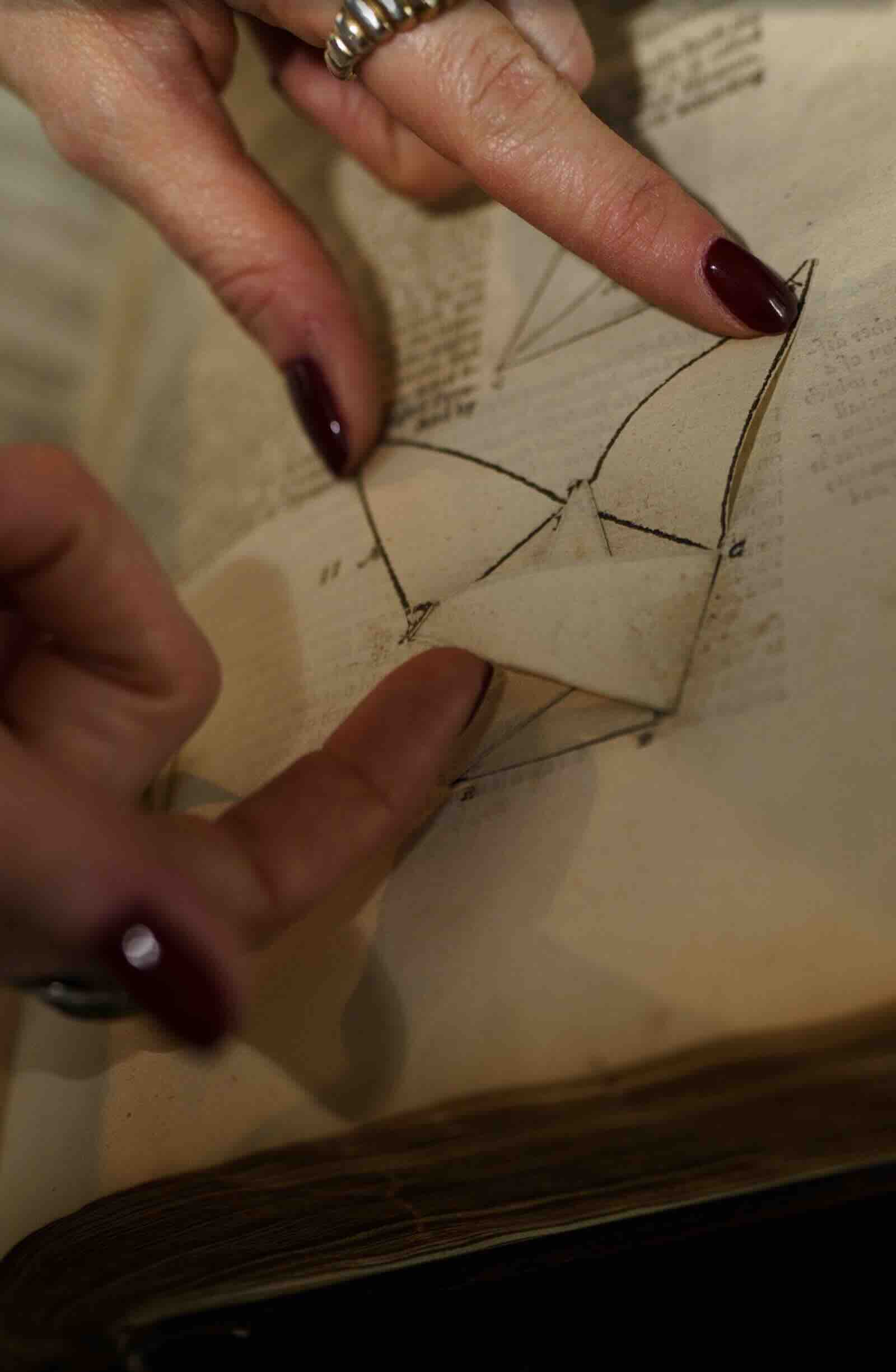 Erin displaying a folding diagram from the first English edition of Euclid's 'Elements'