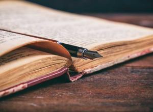 Old book and pen