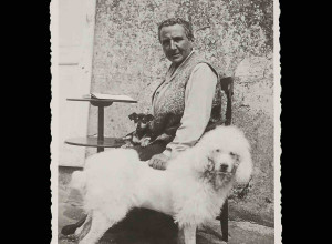 Gertrude Stein at Bilignin, France, with her dogs Pépé and Basket, ca. 1933