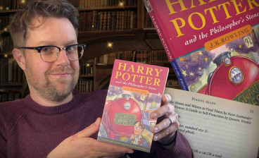Jim Spencer with the paperback copy of Harry Potter and the Philosopher’s Stone