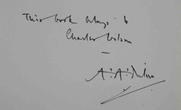 The copy of Winnie-the-Pooh inscribed by Milne on the front free endpaper