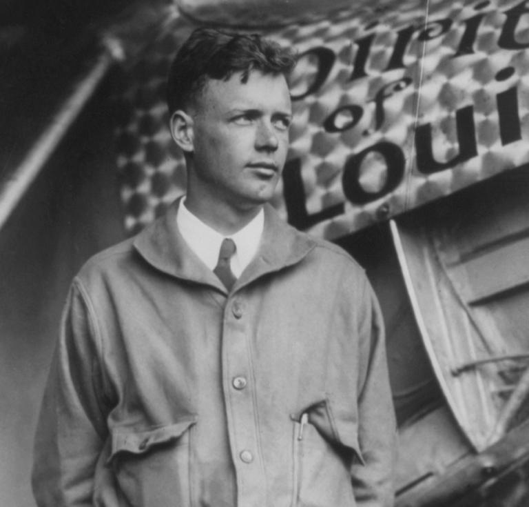 Charles A. Lindbergh, with Spirit of St. Louis in background, May 31, 1927