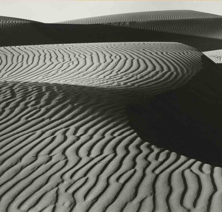 Edward Weston, (1886–1958), Wind Erosion, Dunes at Oceano, 1936, gelatin silver print, mounted on card, likely printed 1940s. Estimate: $150,000-$250,000.