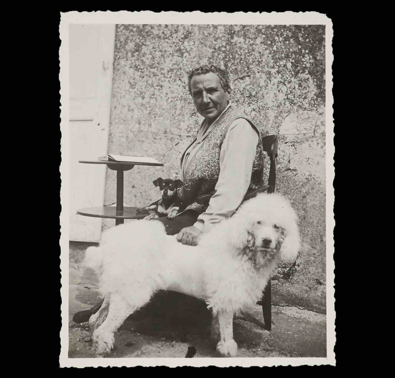 Gertrude Stein at Bilignin, France, with her dogs Pépé and Basket, ca. 1933