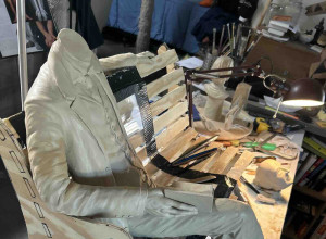 Robert Louis Stevenson figure and bench structure during the sculpting process